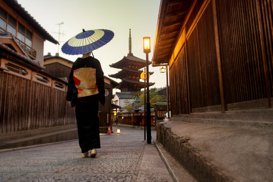 Asian Woman With Kimono Walking At Yasaka Pagoda In Kyoto