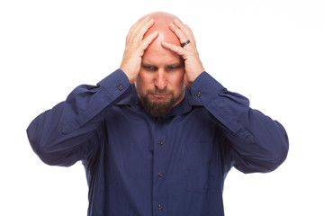 Man looking stressed out on white background.