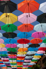 Fototapeta na wymiar Sun umbrellas against the sky