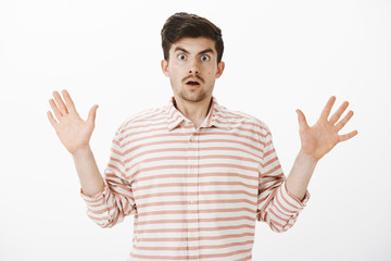 Terrified hostage afraid of being shot. Portrait of intense shocked european man with beard,...