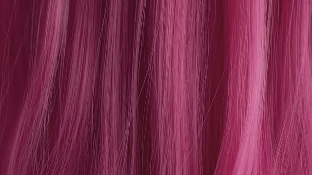 Closeup of pink hair creative colored texture slow movement of hair pink hair texture