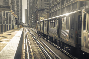 Fototapeta premium Train leaving station in early morning