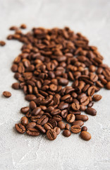 Coffee beans on a stone background
