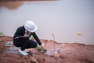 Engineer woman working at site of bridge under construction