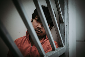 Hands of men desperate to catch the iron prison,prisoner concept,thailand people,Hope to be free,A...