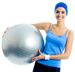 Fototapeta premium Cheerful smiling woman with fitball, over white