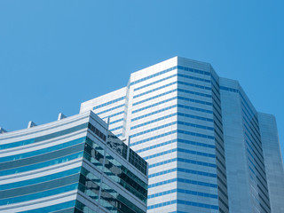 Fototapeta premium Angle view of modern building with a clear blue sky in background