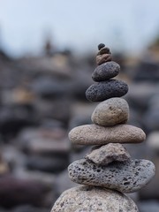 Mobile phone from stones on beach close-up