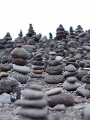 Fototapeta na wymiar Mobile phone from stones on beach close-up