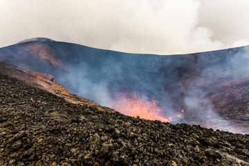Hot lava fountain, erupting from crater active volcano Tolbachik Eruption, Kamchatka Peninsula, Russia