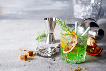 Glass of cocktail green fairy with lemon and absinthe