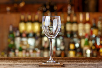 Empty wine glass on the bar