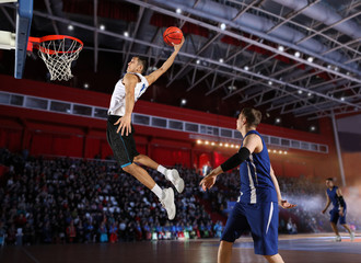 Fototapeta premium Two basketball players in action