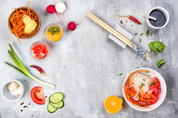 Spicy glass noodles with vegetables - carrots, cucumber, peppers, garlic.