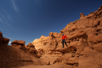 Fototapeta na wymiar Hiker visit Goblin valley state park in Utah, USA