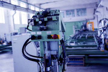 Factory for aluminum and PVC windows and doors production. Details industrial equipment.
