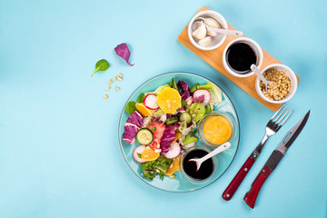 Obraz na płótnie Canvas Organic vegetarian salad with vegetables and sauce.