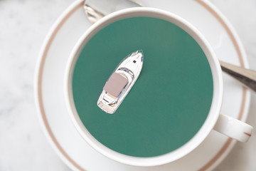 yacht sailing ion the sea in a cup of coffee for travel and relax concept