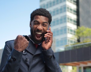 Beautiful happy businessman outside