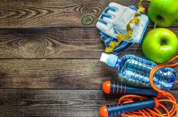 Fitness concept with dumbbells and fresh fruits