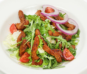 Warm beef salad with beef tenderloin, cherry tomatoes, salad mix, sauces