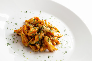 seafood marinated in orange juice, vinegar, and garlic fried in olive oil and decorated with cilantro