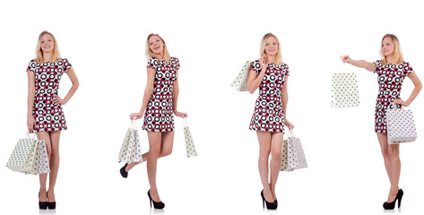 Young woman with shopping bags on white