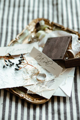 beautiful wedding decor. Wedding and engagement rings on wedding bouquet background. delicate tones and fresh flowers.