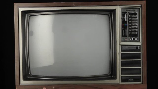 Isolated old television turning on