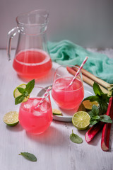 Refreshing summer rhubarb lemonade drink with lime and mint
