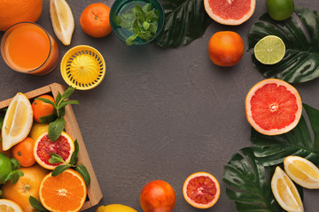 Variety of ripe citruses on black background