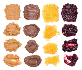Chocolate, peanut butter and jelly on white background
