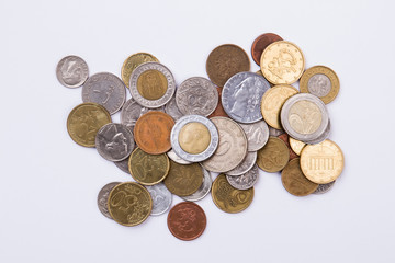 Pile of coins collection. Different coins on white isolated background.