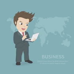 Happy businessman smiling and watching laptop with global map background.