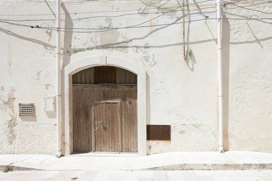 Vieste, Apulia - A folding gate, two rainwater pipes and some cables