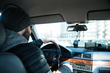 Portrait of man in his car.