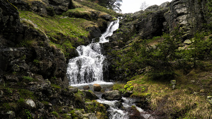waterfall flowing from the mountain