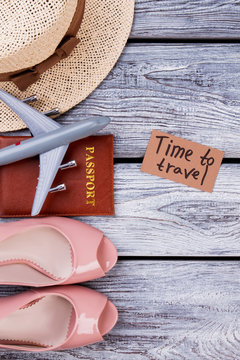 Flat lay traveler accessories on wooden background. Blank space for text. Top view travel items.