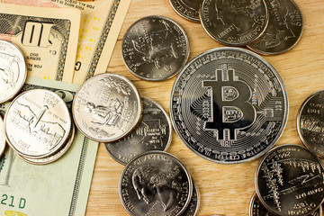 Cryptocurrency Bitcoin. USA dollars and worlds silver coins
