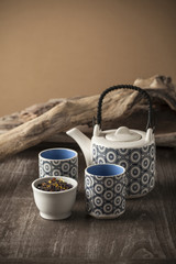 White and blue tea set on wooden table