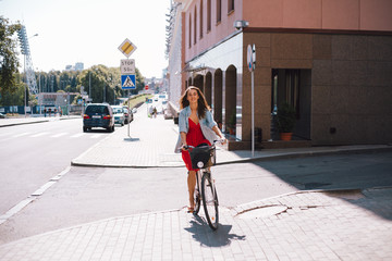Fototapeta premium Girl riding bike street. Adventure vacation. Adventure holiday. Beautiful girl. Caucasian people outdoors.