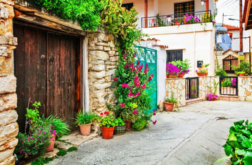 Fototapeta na wymiar Beautiful floral streets of traditioanl villages of Cyprus island