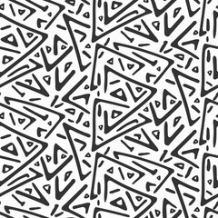 Monochrome chaotic tribal triangles seamless pattern. Trendy fashion vector geometric texture with hand drawn shapes for textile, wrapping paper, cover, surface, wallpaper