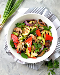 Grilled vegetables - zucchini, portobello mushrooms, red pepper, red onion, green onion, garlic, olive oil, wine vinegar, sea salt and parsley. Healthy food.
