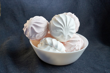 white and pink zephyr close-up on a white plate