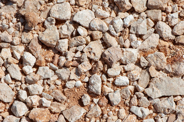 Texture of stones and sand, orange tones