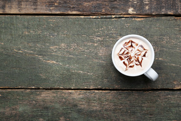Cup of coffee on grey wooden table