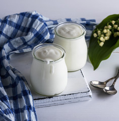 two glass jars with homemade yogurt