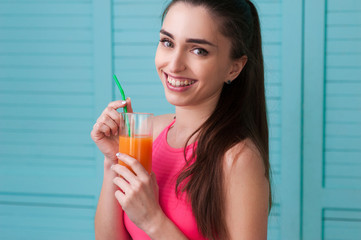 Smiling woman with glass of juice