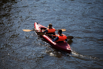 Two sail in a kayak
